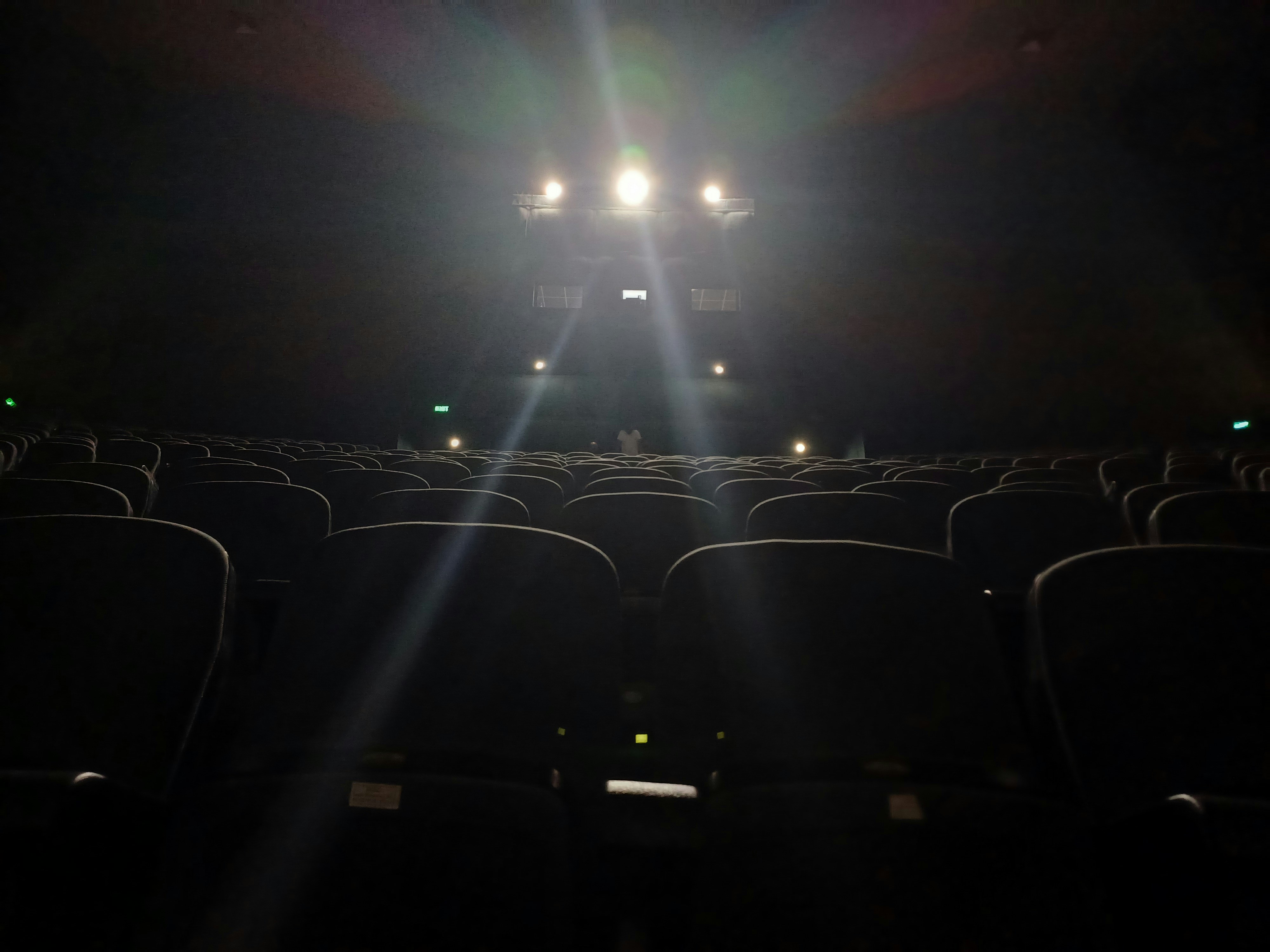 cinema seats and linghts in dark background