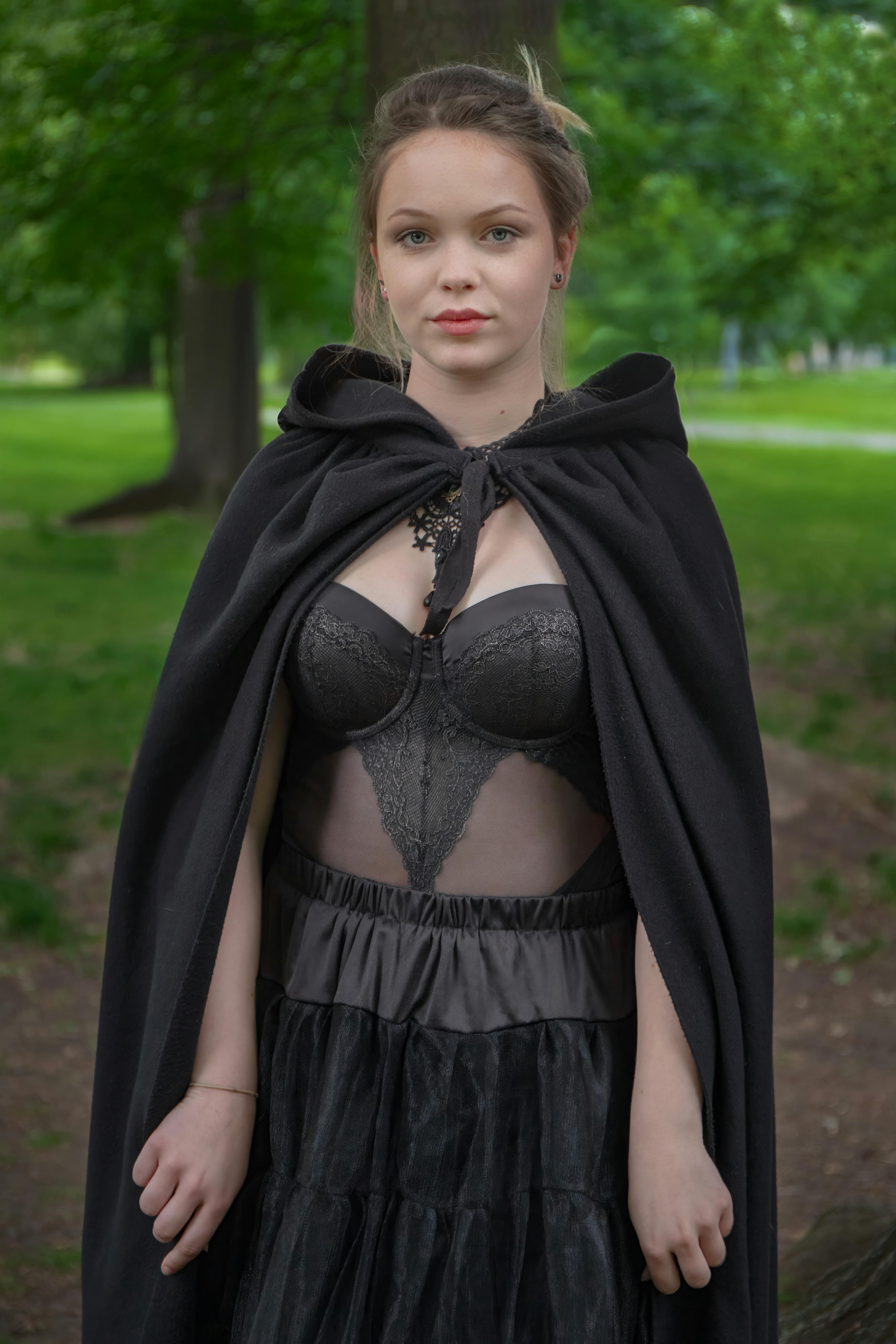 blond woman at forest in witch costume